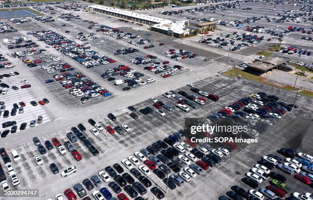 Rows of used cars are seen in this aerial view of the Manheim Auto Auction facility in Ocoee, which is the world's largest wholesale auto auction,...