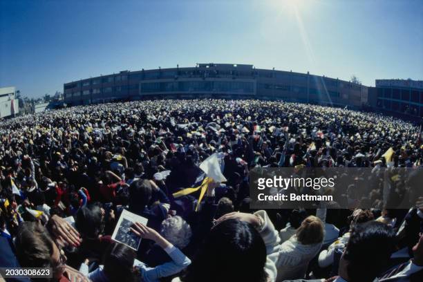 Large crowd listens as Pope John Paul II speaks from a balcony at Miguel Angel School in Guadalajara, Mexico, January 30th 1979.