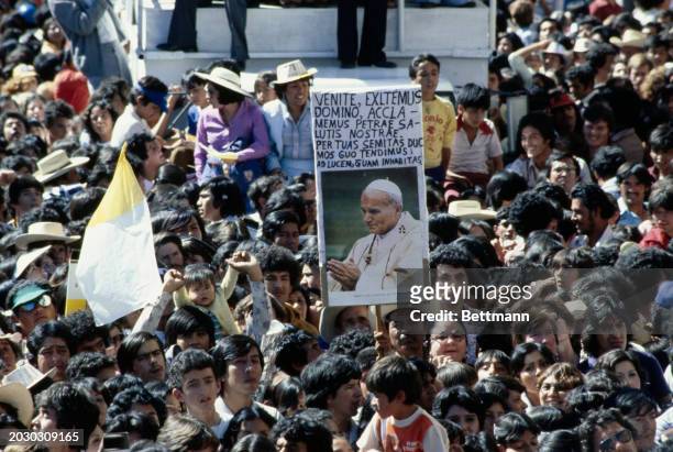 Photo of Pope John Paul II held up in a crowd in Guadalajara, Mexico, January 30th 1979.