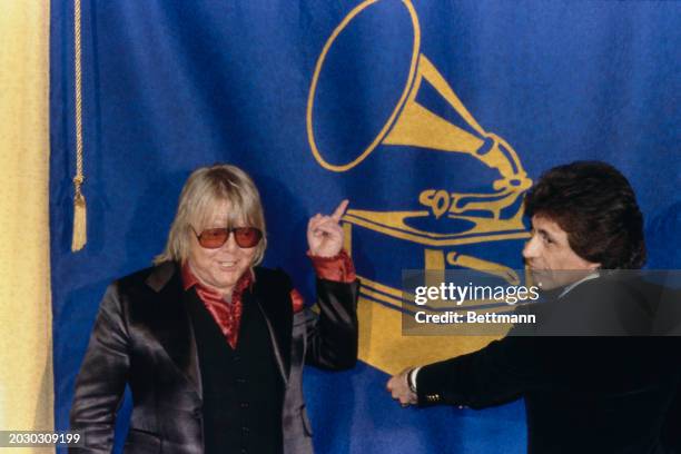 American songwriter Paul Williams and singer Frankie Valli attending the Grammy Awards in Los Angeles, February 15th 1979. Williams, wearing tinted...