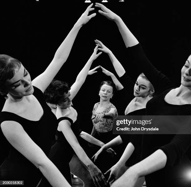 British choreographer Pauline Grant instructing dancers during a rehearsal for 'Summer Song', a musical showing at the Princes Theatre in London,...