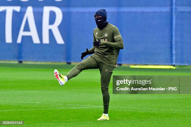 Nuno Mendes warms up during a Paris Saint-Germain training session at Campus PSG on February 22, 2024 in Paris, France.