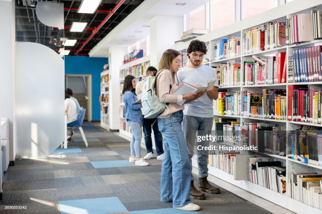 Group of students researching at a library