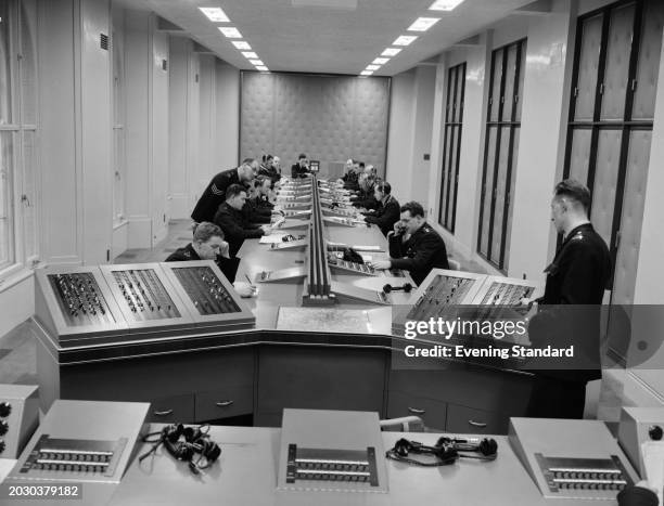 Telephone operators working the 999 emergency service in the new information room at Scotland Yard's headquarters in London, December 28th 1956.