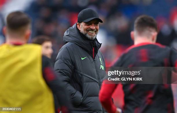 Liverpool's German manager Jurgen Klopp watches his players warm up ahead of the English League Cup final football match between Chelsea and...