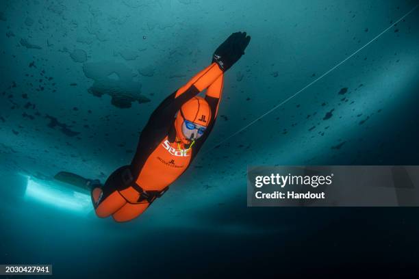 In this handout provided by Limex Images, Valentina Cafolla of Croatia is seen during her record dive in the category "Dynamic Freedive under ice" at...