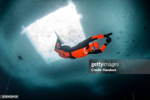 In this handout provided by Limex Images, Valentina Cafolla of Croatia is seen during her record dive in the category "Dynamic Freedive under ice" at...