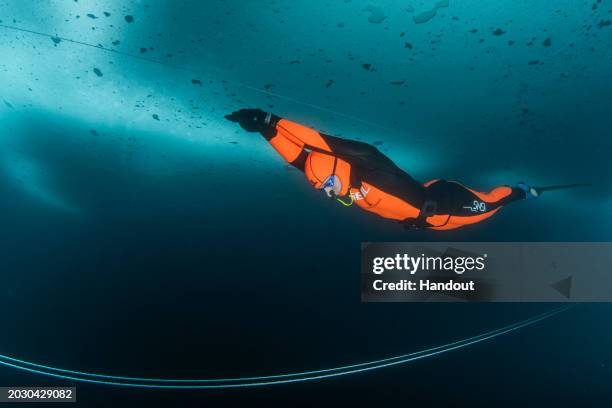 In this handout provided by Limex Images, Valentina Cafolla of Croatia is seen during her record dive in the category "Dynamic Freedive under ice" at...