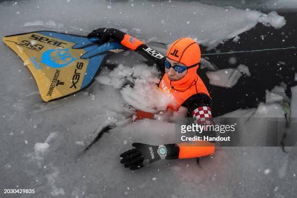 In this handout provided by Limex Images, Valentina Cafolla of Croatia is seen during her record dive in the category "Dynamic Freedive under ice" at...