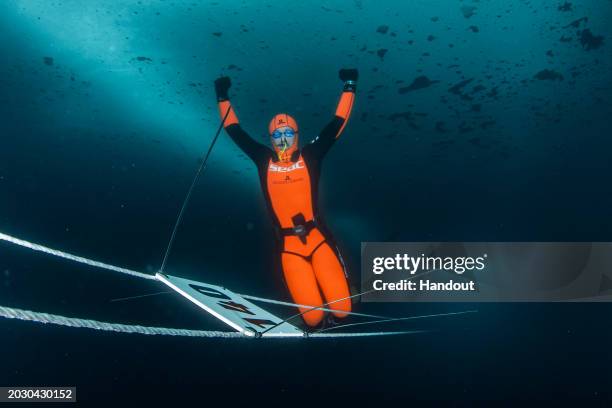 In this handout provided by Limex Images, Valentina Cafolla of Croatia is seen during her record dive in the category "Dynamic Freedive under ice" at...