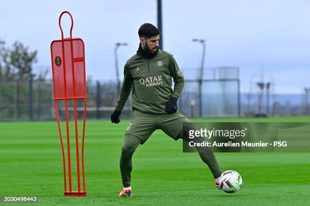Marco Asensio passes the ball during a Paris Saint-Germain training session at Campus PSG on February 22, 2024 in Paris, France.