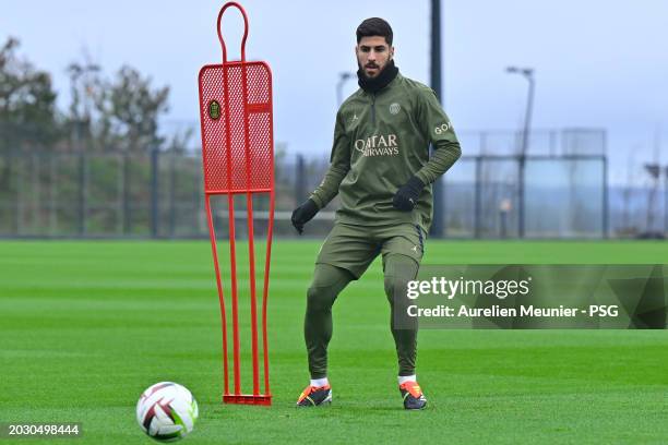 Marco Asensio passes the ball during a Paris Saint-Germain training session at Campus PSG on February 22, 2024 in Paris, France.