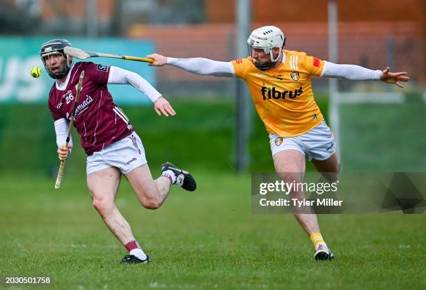 Northern Ireland , United Kingdom - 25 February 2024; Jamie Ryan of Galway in action against Paddy Burke of Antrim during the Allianz Hurling League...