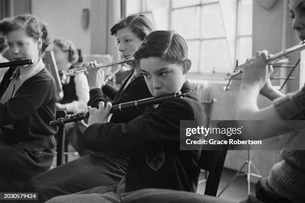 Irene Vermes, Lorna Race and George Wilson of the London County Council's Symphony Orchestra for Schoolchildren, during a five day holiday programme...