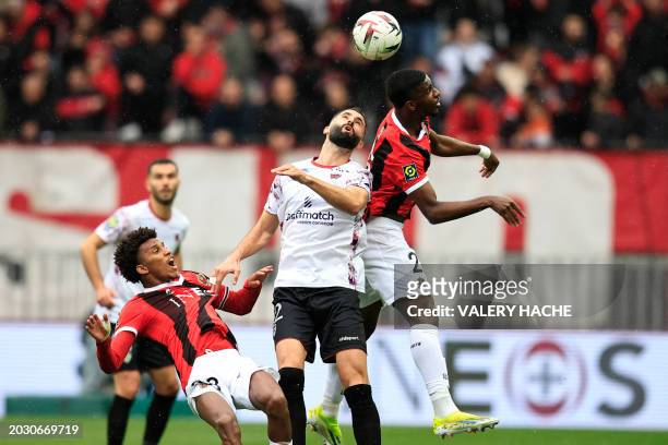 Clermont-Ferrand's French midfielder Maxime Gonalons fights for the ball with Nice's Algerian defender Hicham Boudaoui and Nice's French forward...