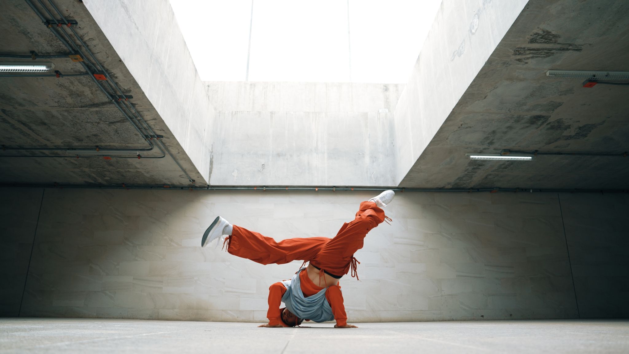 Dancing man enjoy practice break dance or freestyle in building. Sprightly. Dancing man enjoy practice break dance or freestyle in building. Sprightly.