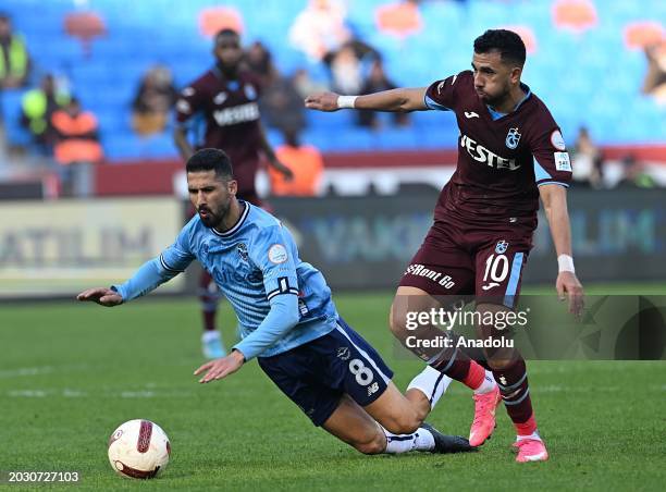 Mahmoud Trezeguet of Trabzonspor in action against Emre Akbaba of Yukatel Adana Demirspor during the Turkish Super Lig week 27 football match between...