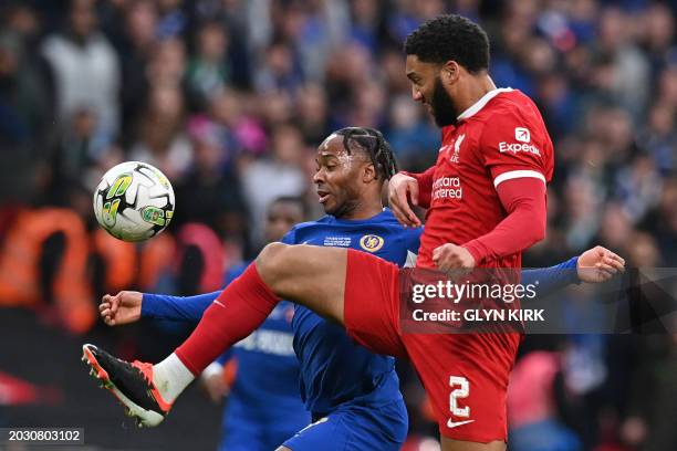 Liverpool's English defender Joe Gomez defends from Chelsea's English midfielder Raheem Sterling during the English League Cup final football match...