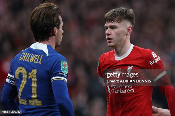 Chelsea's English defender Ben Chilwell and Liverpool's Northern Irish defender Conor Bradley clash during the English League Cup final football...
