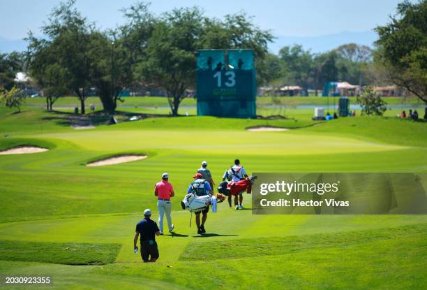 Patrick Rodgers of the United States, Stephan Jaeger of Germany and Jhonattan Vegas of Venezuela walk to the 13th green during the first round of the...