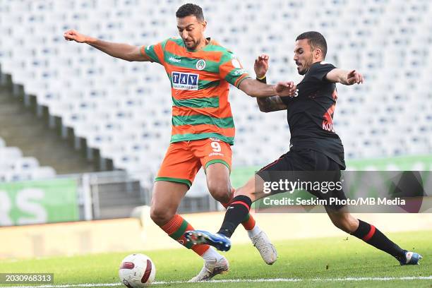 Dimitris Kourbelis of Fatih Karagumruk and Ahmed Hassan of Alanyaspor battle for the ball during the Turkish Super League match between Fatih...