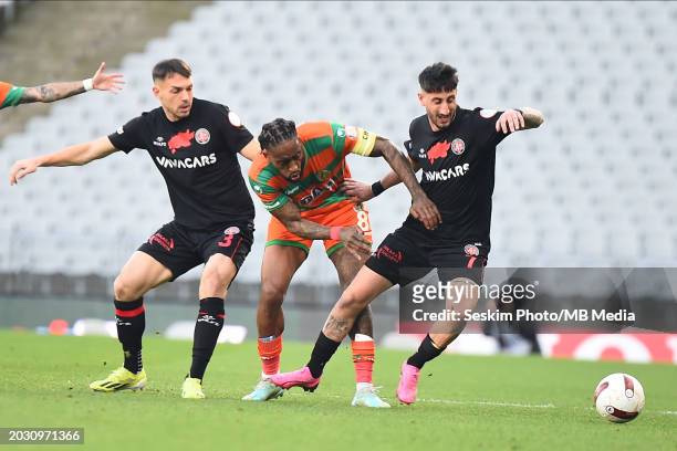Frederic Veseli , Can Keles of Fatih Karagumruk and Leroy Fer of Alanyaspor battle for the ball during the Turkish Super League match between Fatih...