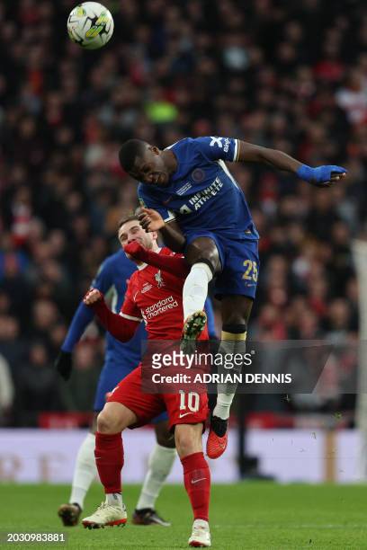 Chelsea's Ecuadorian midfielder Moises Caicedo jumps to win a header during the English League Cup final football match between Chelsea and Liverpool...