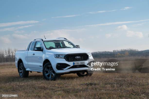 ford ranger ms-rt on a grass - white ford truck stock pictures, royalty-free photos & images