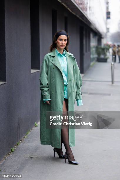 Maria Pombo wears green coat, black head band, tights, turquoise button shirt, shorts outside Max Mara during the Milan Fashion Week - Womenswear...