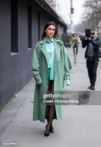 Maria Pombo wears green coat, black head band, tights, turquoise button shirt, shorts outside Max Mara during the Milan Fashion Week - Womenswear...