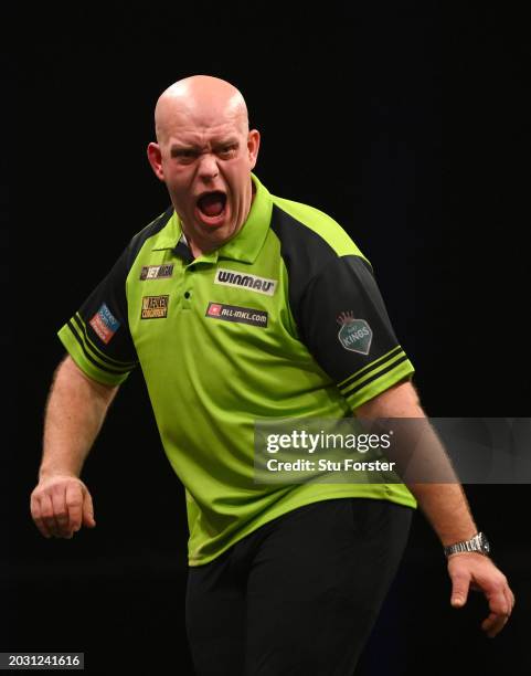 Michael van Gerwen celebrates after beating Luke Littler in the semi final during the 2024 BetMGM Premier League Darts at Utilita Arena on February...