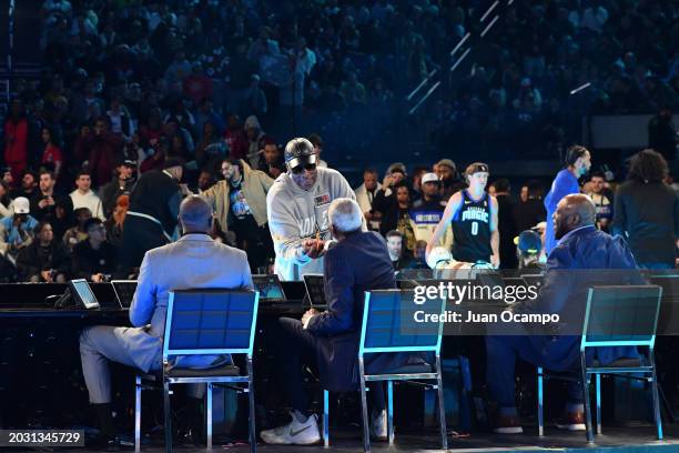 Julius Erving talks to Darnell Hillman as a part of State Farm All-Star Saturday Night on Saturday, February 17, 2024 at Lucas Oil Stadium in...