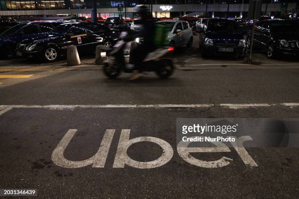 Uber logo is seen at pick-up spot in Warsaw, Poland on February 24, 2024.