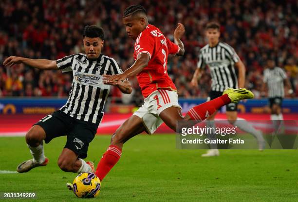 David Neres of SL Benfica with Guga of Portimonense SC in action during the Liga Portugal Betclic match between SL Benfica and Portimonense SC at...