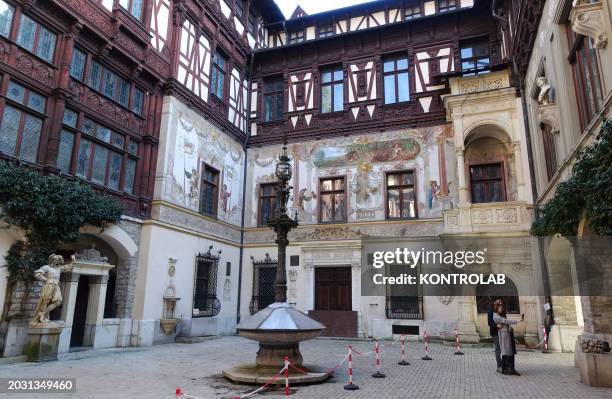 View of frescoed courtyard to Peles Castle in the city of Sinaia, Greater Wallachia.