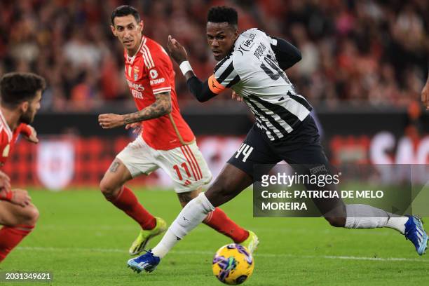 Benfica's Argentine forward Angel Di Maria vies with Portimonense's Brazilian defender Pedrao during the Portuguese League football match between SL...