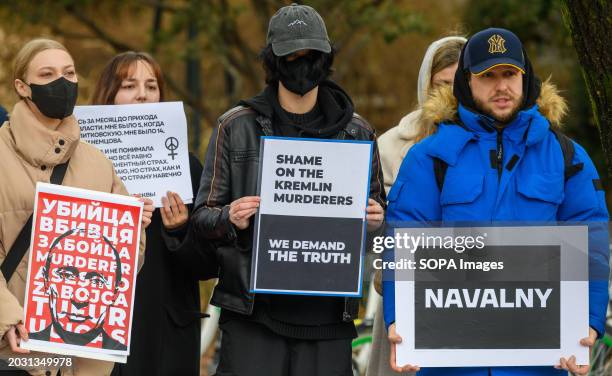 Russians hold placards protesting against Alexei Navalny's death and against the war with Ukraine. Alexei Navalny was a Russian opposition leader,...