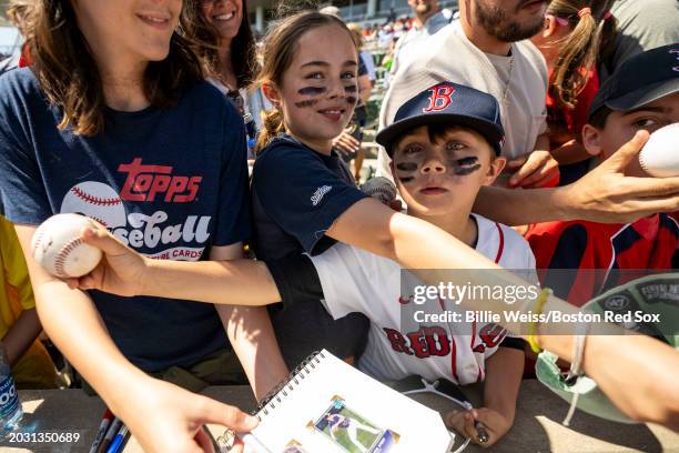 Young fans react as they receive autographs before a Spring Training Grapefruit League between the Boston Red Sox and he Minnesota Twins on February...