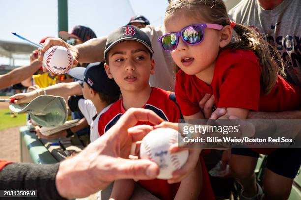Young fans react as they receive autographs before a Spring Training Grapefruit League between the Boston Red Sox and he Minnesota Twins on February...