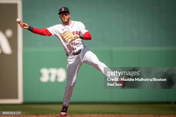 Trevor Story of the Boston Red Sox throws during the first inning of a Spring Training game against the Minnesota Twins at JetBlue Park at Fenway...