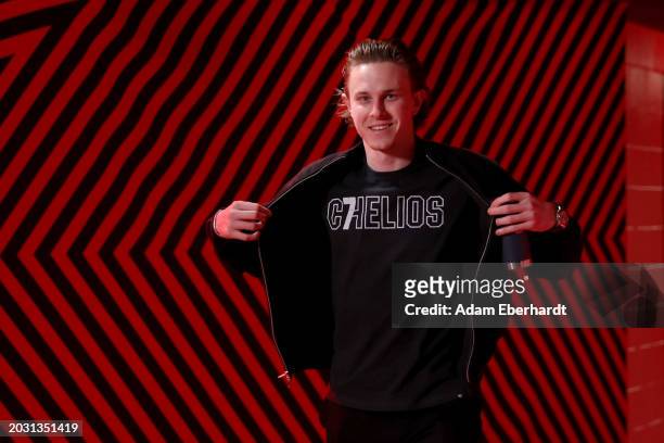 MacKenzie Entwistle of the Chicago Blackhawks wears a shirt in honor of Chris Chelios for arrival at the United Center prior to the game between the...
