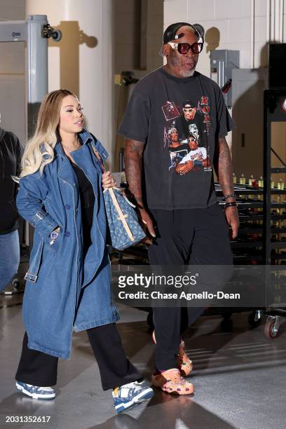 Dennis Rodman and girlfriend Yella Yella arrive at the United Center prior to the game between the Chicago Blackhawks and the Detroit Red Wings on...