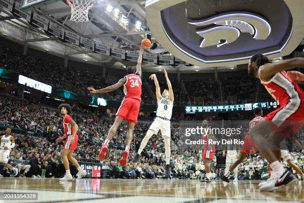 Jaxon Kohler of the Michigan State Spartans shoots the ball over Felix Okpara of the Ohio State Buckeyes during the first half at Breslin Center on...