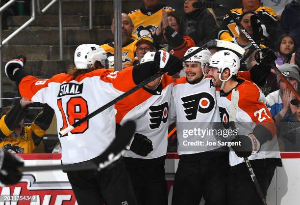 Scott Laughton of the Philadelphia Flyers celebrates his goal with teammates during the second period against the Pittsburgh Penguins at PPG PAINTS...