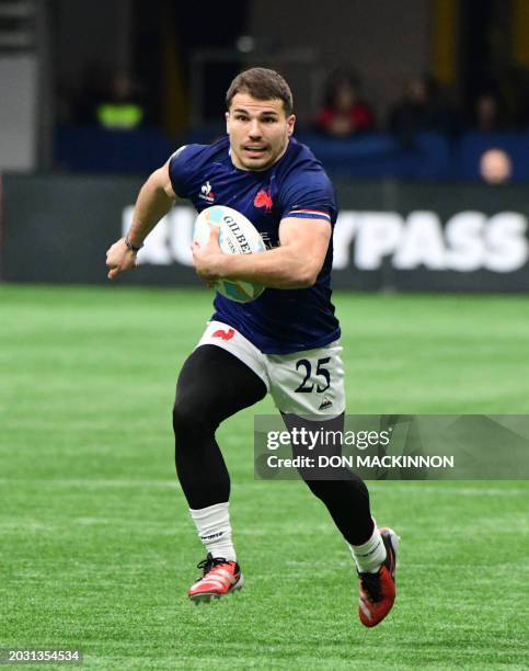 France's Antoine Dupont controls the ball during the 2024 HSBC Canada Sevens rugby tournament match between France and New Zealand at BC Place...