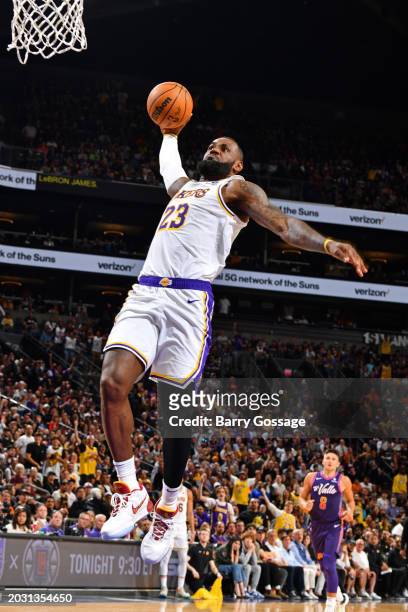 LeBron James of the Los Angeles Lakers dunks the ball during the game against the Phoenix Suns on February 25, 2024 at Footprint Center in Phoenix,...