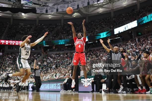 Dale Bonner of the Ohio State Buckeyes shoots a three-pointer over Malik Hall of the Michigan State Spartans during the second half at Breslin Center...