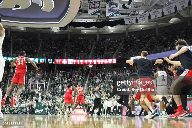 Dale Bonner of the Ohio State Buckeyes celebrates his game winning basket against the Michigan State Spartans at Breslin Center on February 25, 2024...