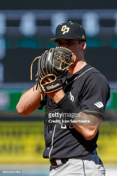 Cal Poly pitcher Ryan Baum covers his face with his glove prior to pitching the ball during the college baseball game between Texas Longhorns and Cal...