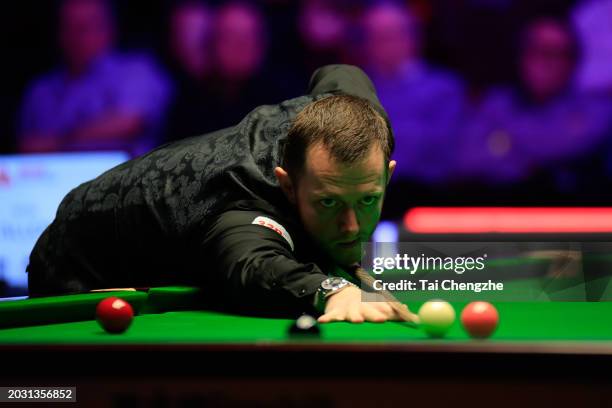 Mark Allen of Northern Ireland plays a shot in the Quarter-final match against Gary Wilson of England on day four of 2024 Players Championship at...